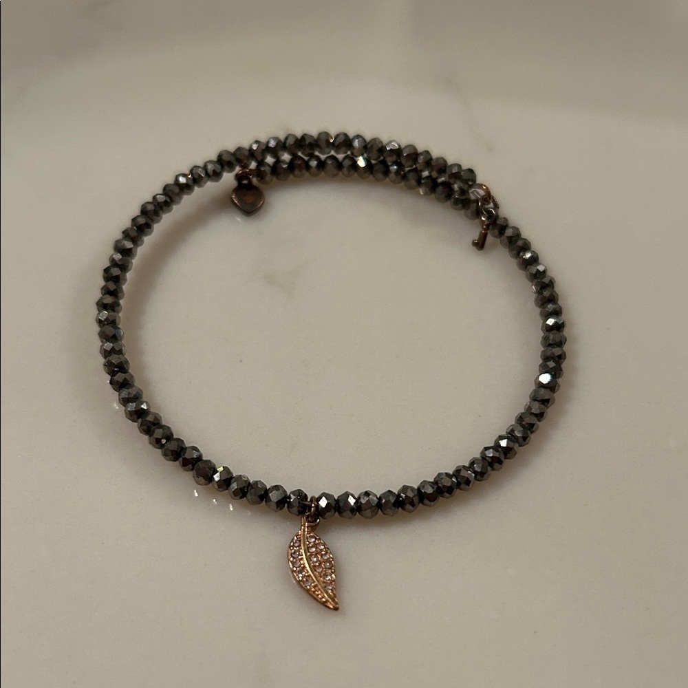 Elegant Black Beaded Bracelet with Gold Leaf Charm